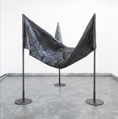 Apparatus 22 Infinite contradiction, 2016 Tre bandiere unite (pelle nera riutilizzata, aste in legno, basi in acciaio); Ed. 2/3 + 3 AP H 200 cm, 140 x 80 cm (ciascuna). Fondazione MUSEION. Museo d'arte moderna e contemporanea Bolzano Apparatus 22 Infinite contradiction, 2016 Tre bandiere unite (pelle nera riutilizzata, aste in legno, basi in acciaio); Ed. 2/3 + 3 AP H 200 cm, 140 x 80 cm (ciascuna). Fondazione MUSEION. Museo d'arte moderna e contemporanea Bolzano
